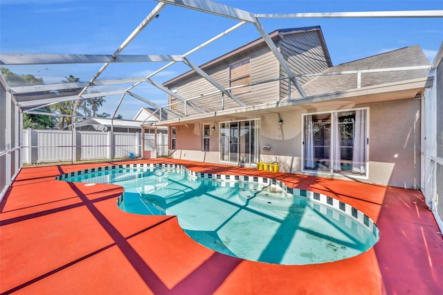 view of pool with a lanai and a patio