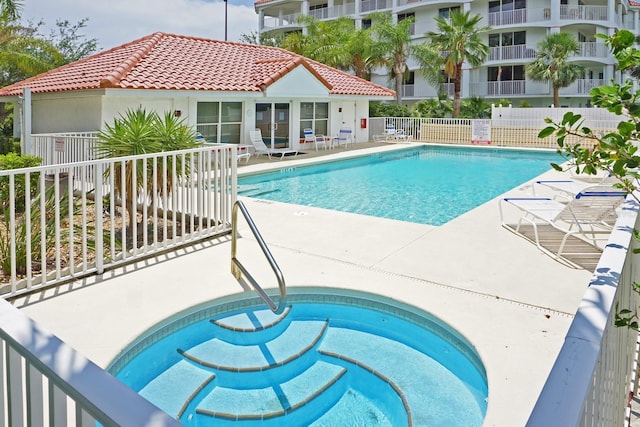 view of swimming pool with a patio