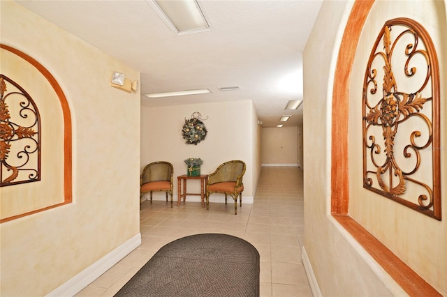 hallway with light tile patterned flooring