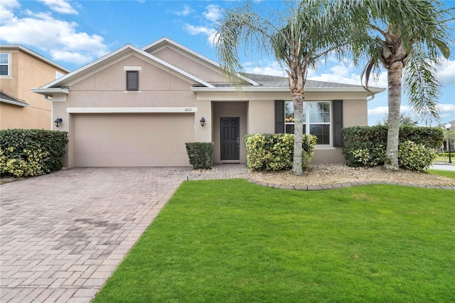 ranch-style home with a front yard and a garage