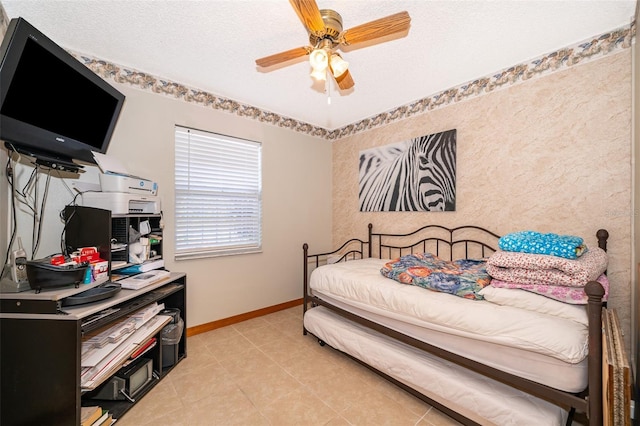 tiled bedroom featuring ceiling fan