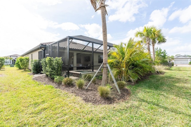 view of yard with glass enclosure