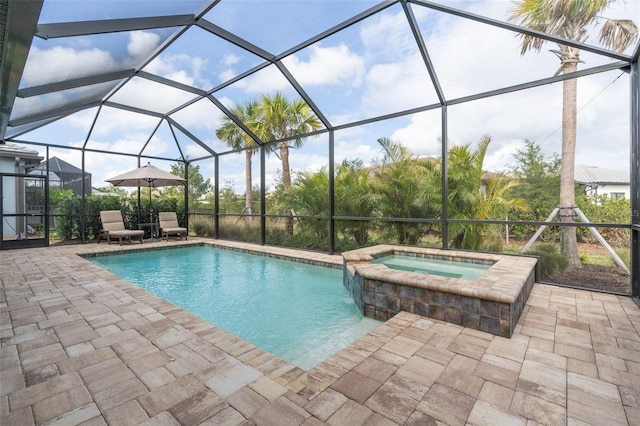 view of swimming pool featuring a lanai, an in ground hot tub, and a patio