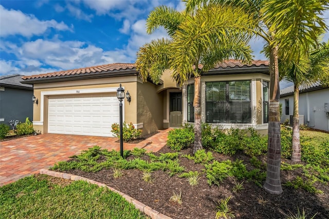 mediterranean / spanish-style house featuring a garage