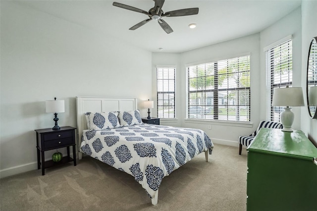 bedroom with ceiling fan and carpet floors