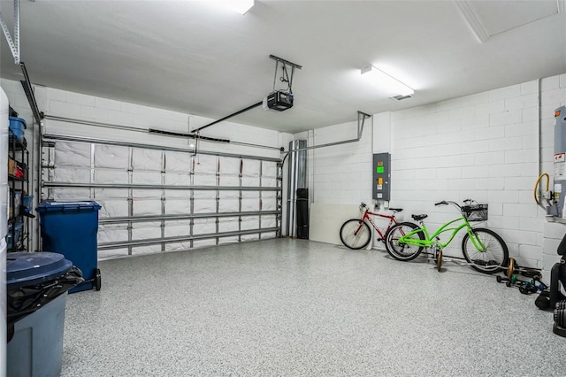 garage featuring electric panel and a garage door opener