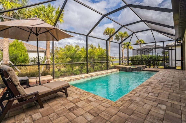 view of swimming pool with a patio area, a lanai, and an in ground hot tub