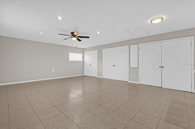 unfurnished room featuring light tile patterned floors and ceiling fan