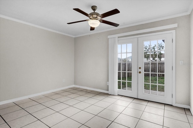 tiled spare room featuring french doors, ceiling fan, and crown molding