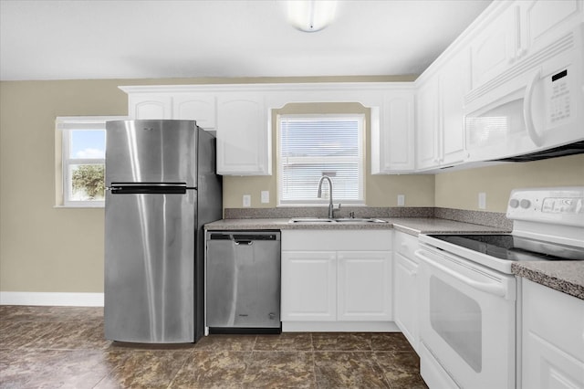 kitchen with white cabinetry, sink, and appliances with stainless steel finishes