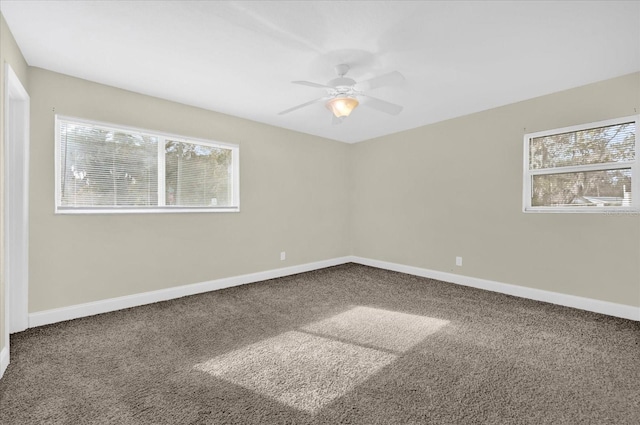 empty room featuring carpet flooring and ceiling fan