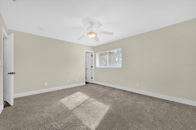 spare room with ceiling fan and carpet floors