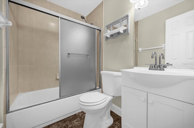 full bathroom with vanity, toilet, and enclosed tub / shower combo