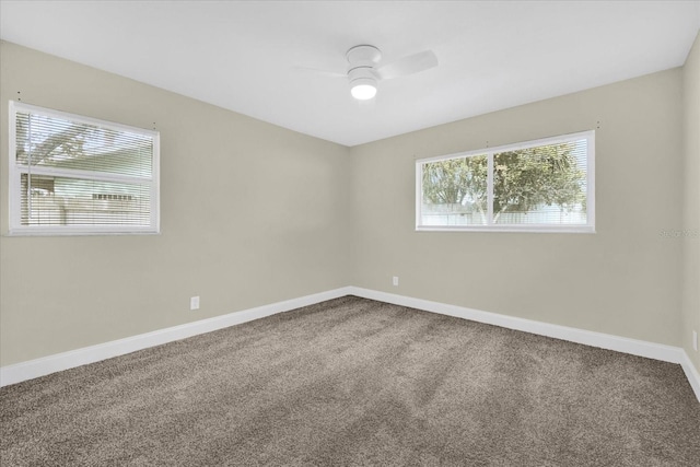 carpeted empty room featuring ceiling fan