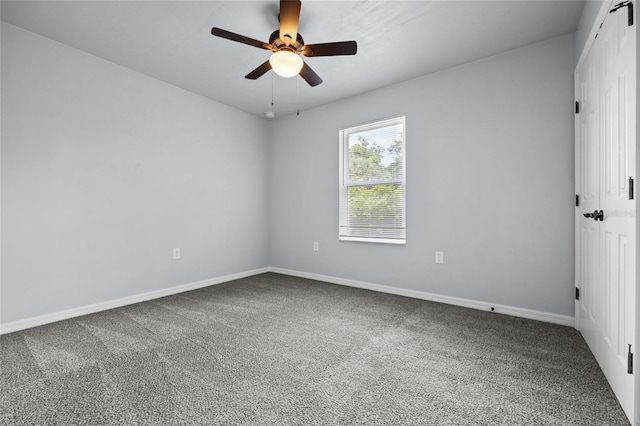 empty room with carpet floors and ceiling fan