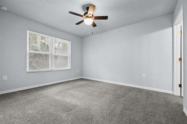 spare room with carpet floors and ceiling fan