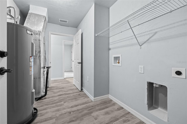 laundry room featuring electric dryer hookup, electric water heater, hookup for a washing machine, and light hardwood / wood-style flooring