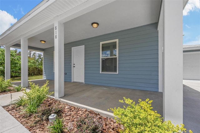 entrance to property with a porch