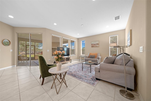 living room featuring a healthy amount of sunlight and light tile patterned flooring