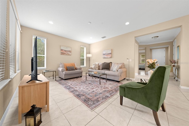 tiled living room featuring ornamental molding