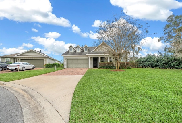 view of front of home with a garage and a front lawn