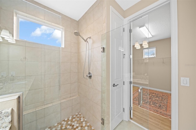 bathroom featuring a shower with door