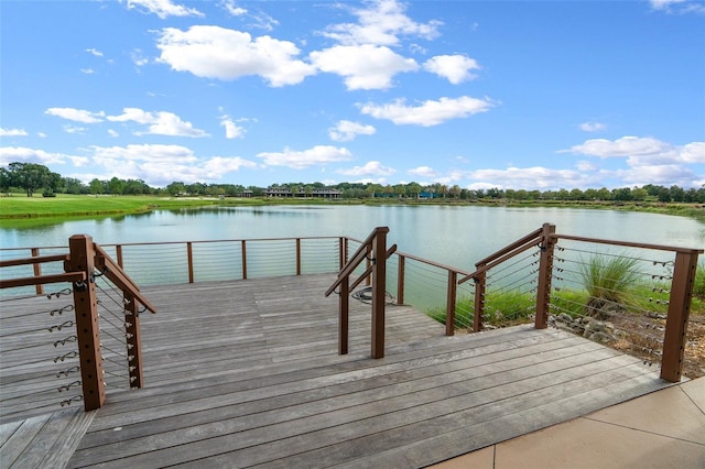 view of dock with a deck with water view