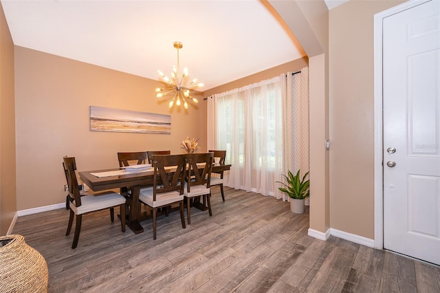 dining space featuring a chandelier and wood-type flooring