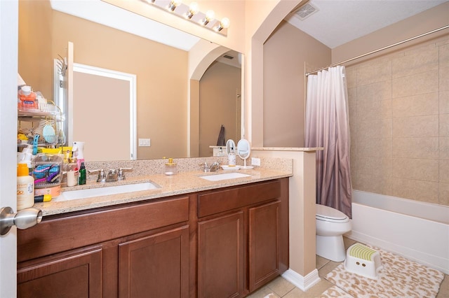 full bathroom featuring toilet, shower / tub combo, vanity, and tile patterned floors