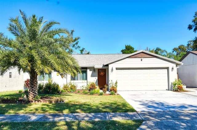 view of front of home featuring a garage and a front yard