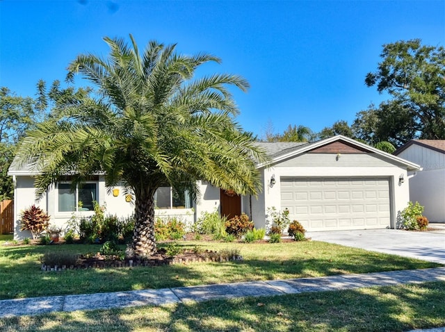 view of front of house with a front yard and a garage