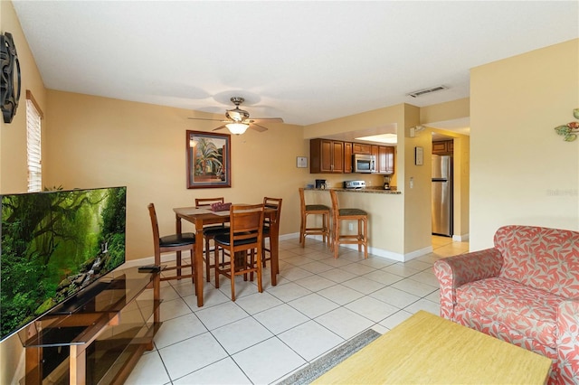 2007 Disney Mgm Studio Ct, Kissimmee, FL 34746 - dining area with light tile patterned floors and a ceiling fan