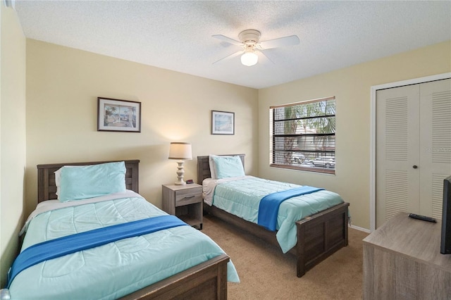 2007 Disney Mgm Studio Ct, Kissimmee, FL 34746 - carpeted bedroom featuring a closet, a textured ceiling, and a ceiling fan