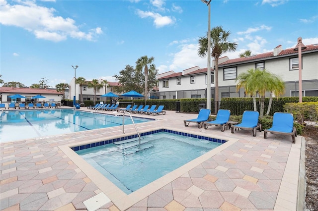 2007 Disney Mgm Studio Ct, Kissimmee, FL 34746 - community pool featuring a community hot tub, a patio, and a residential view