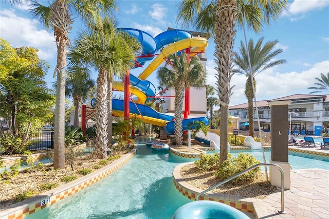 view of swimming pool with a playground