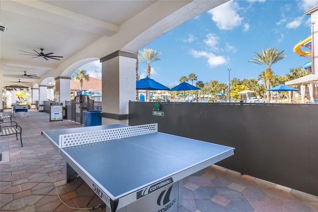 view of patio featuring ceiling fan