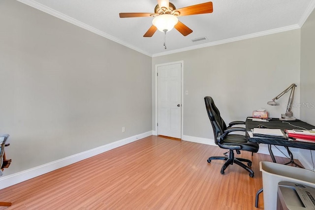 office area with ceiling fan, wood finished floors, visible vents, baseboards, and ornamental molding