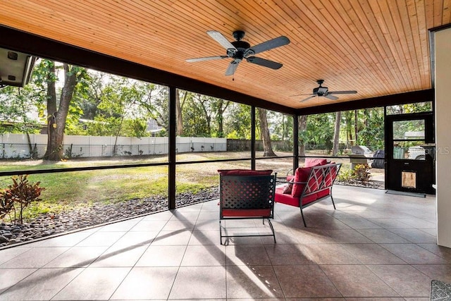 sunroom featuring wooden ceiling