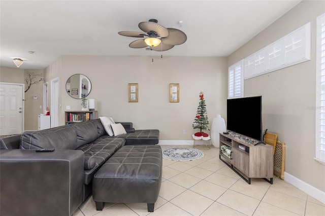 tiled living room with ceiling fan