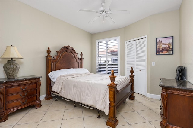 tiled bedroom with ceiling fan and a closet