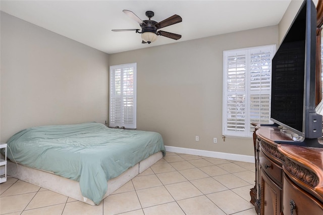 tiled bedroom with ceiling fan