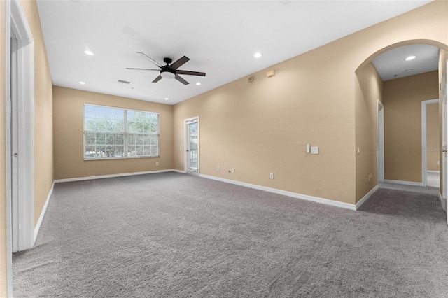 carpeted empty room featuring ceiling fan