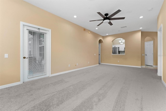 carpeted empty room featuring ceiling fan