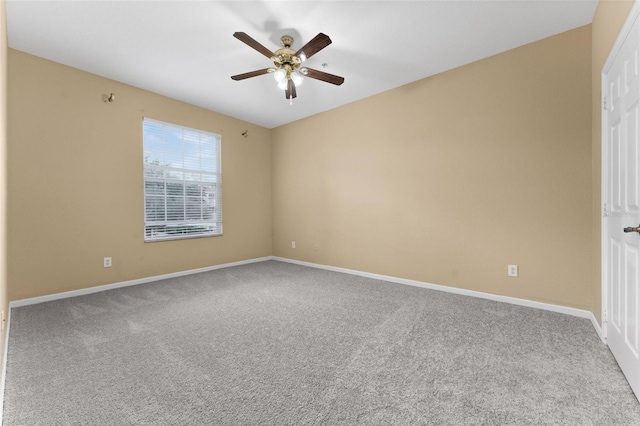 carpeted empty room featuring ceiling fan