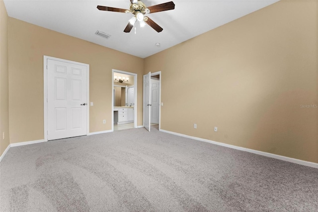 unfurnished bedroom with carpet flooring, ceiling fan, and ensuite bathroom