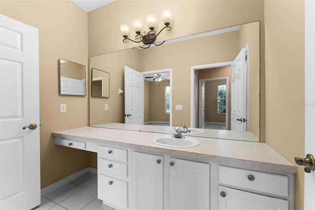 bathroom featuring tile patterned flooring, vanity, and ceiling fan