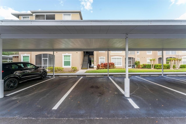 view of vehicle parking with a carport