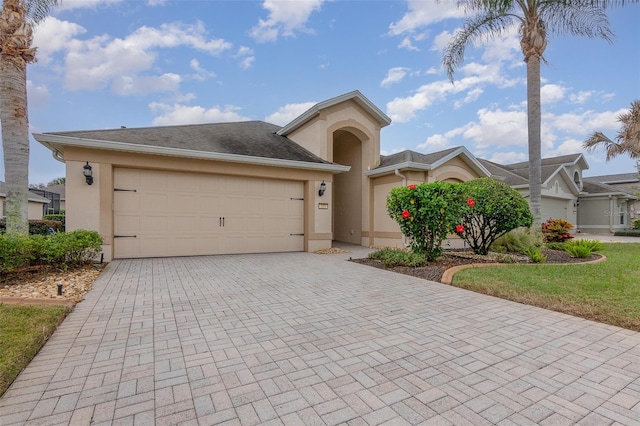 view of front of property with a garage