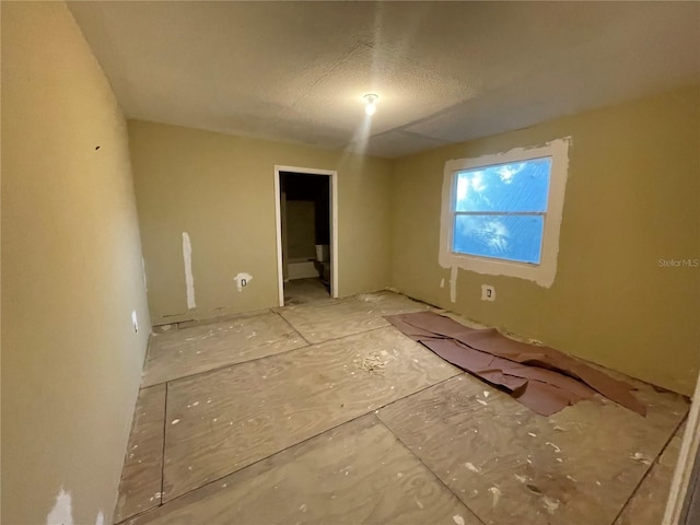 spare room featuring a textured ceiling