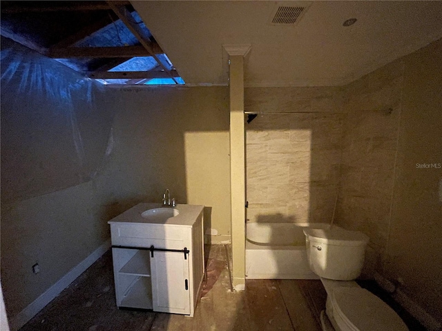 bathroom featuring vanity, wood-type flooring, and toilet